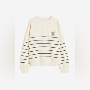 H & M Striped Sweatshirt
Color: Cream/black * Size: L